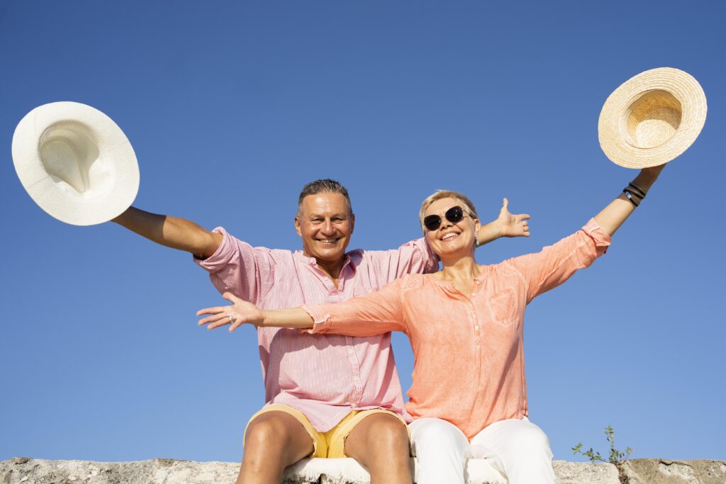 Feel Brazil: Gentle Journeys Full of Stories medium shot couple sitting cliff